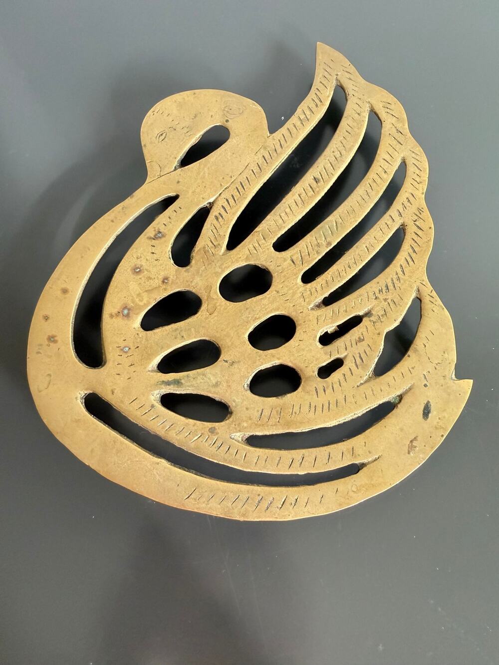Vintage solid brass swan trivet openwork design with etched feather details
